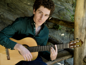 Collin Fullerton holding guitar