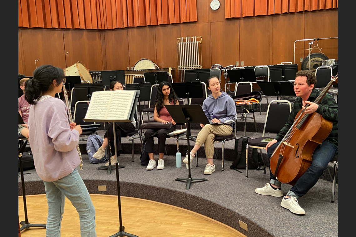 Flute student performing in front of a class