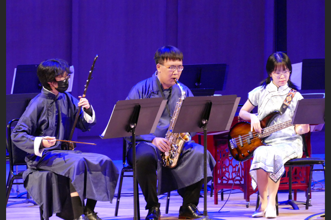 Students playing erhu, saxophone, guitar