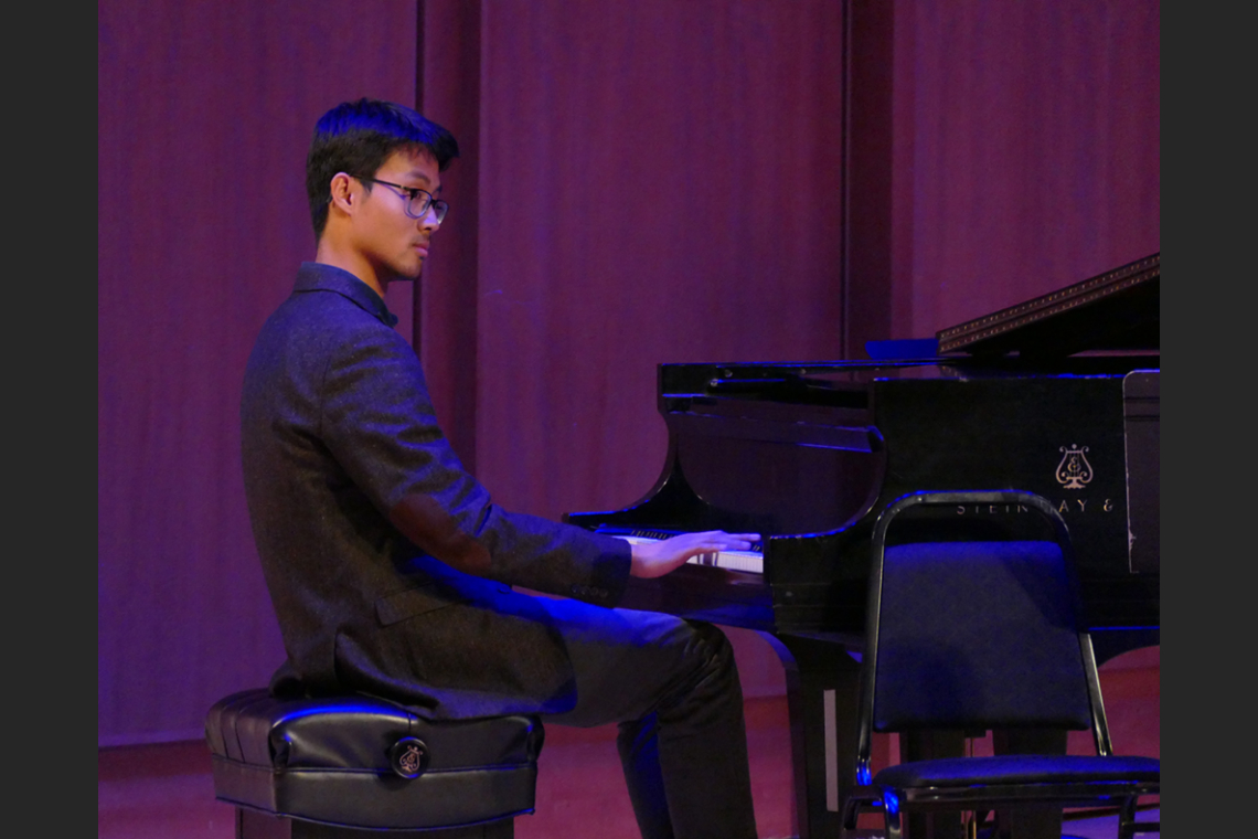 Student playing the piano