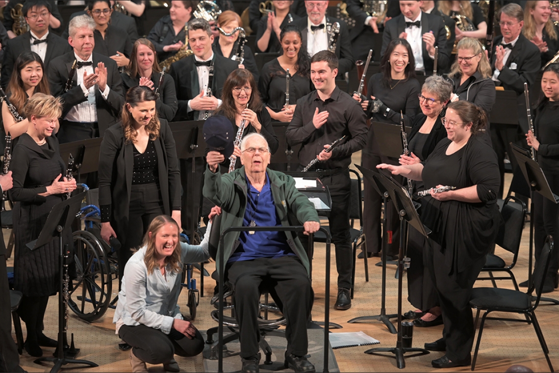 Professor Bryan with the Wind Symphony and alumni
