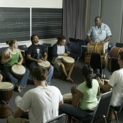 Group of students playing Djembe