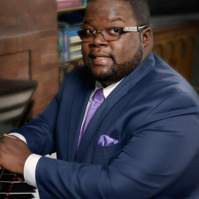 Braxton Shelley seated at a piano keyboard